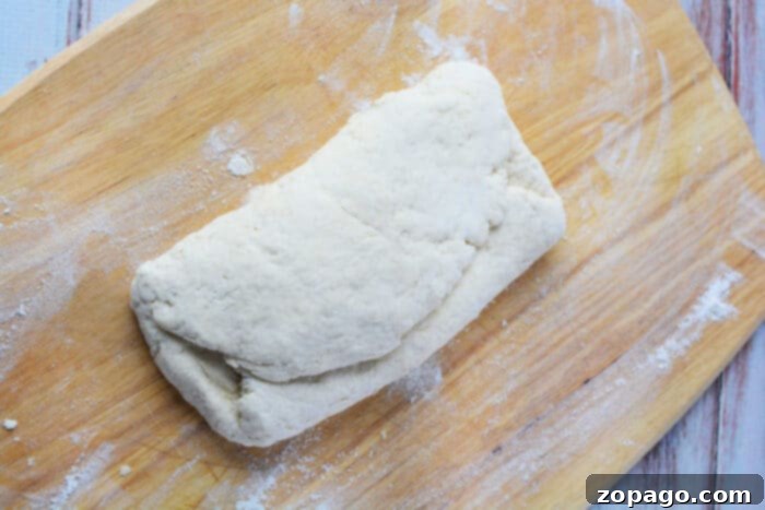 The Secret to Irresistible Homemade Biscuits 5 Flaky Buttermilk Biscuits, showing layers and golden tops.
