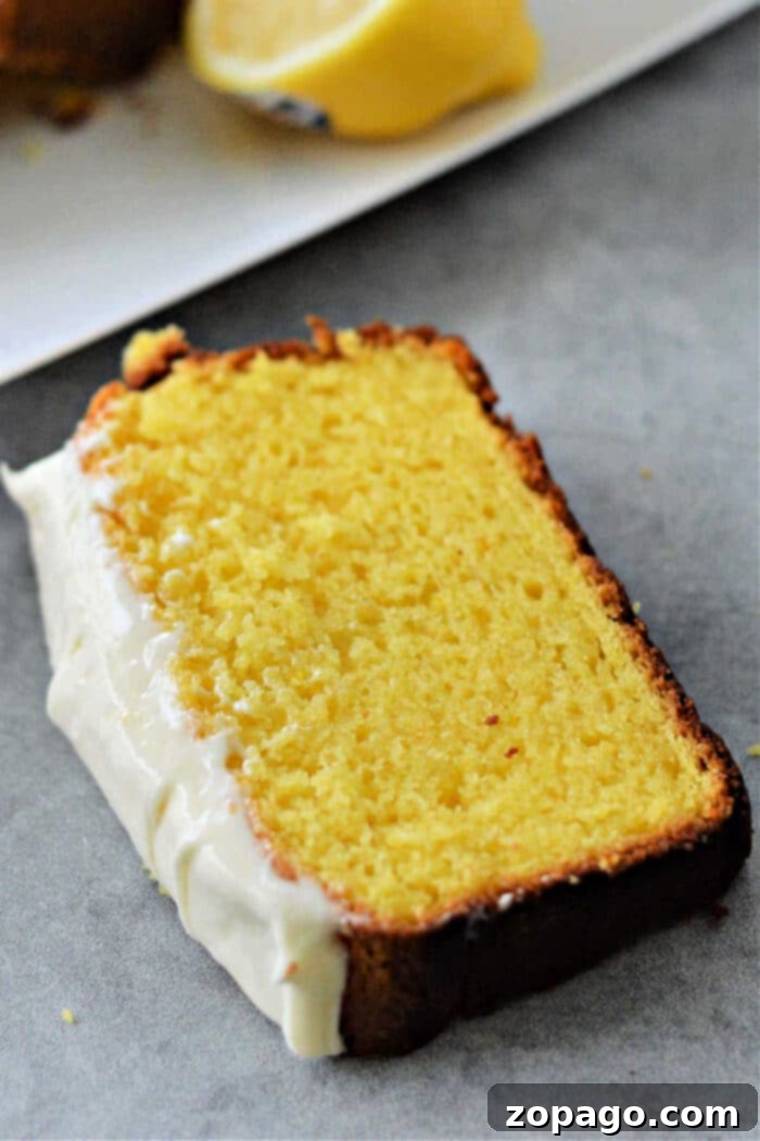 Pound Cake From Cake Mix served on a plate with frosting.