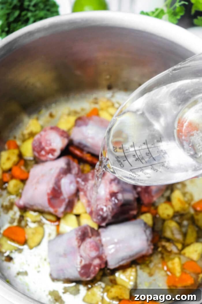 Aromatic Pho Essence 2 Pho Broth Recipe - Aromatic homemade pho broth simmering gently.