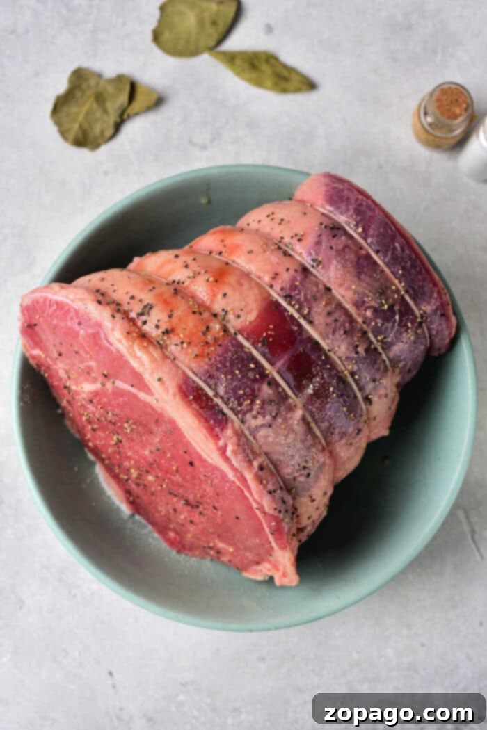 Perfect Roast: Timing Your Cook 3 A perfectly cooked Beef Shoulder Roast, golden brown and resting on a cutting board, ready to be sliced and served for a hearty meal.