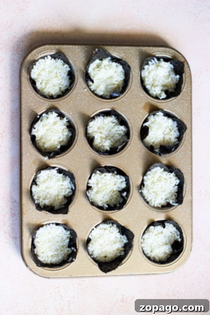 Mini Salmon Sushi Delights 4 Close-up of prepared salmon chunks marinated in a creamy sauce, ready for assembly into sushi cups.