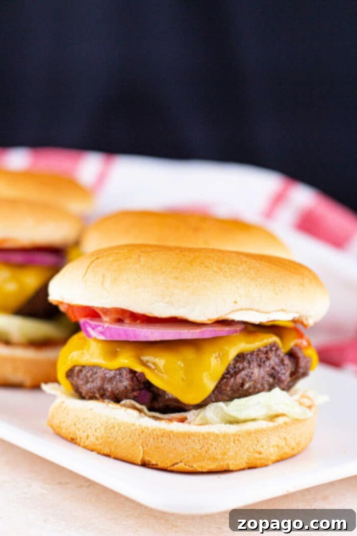 Hamburger patties with melted cheese fresh from the oven