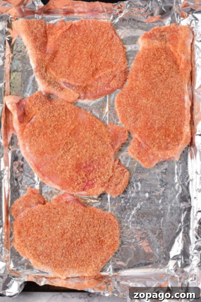 Thin Pork Chops in the Oven: Optimal Cooking Times 5 Cooked thin pork chops in the oven, ready for resting before serving.
