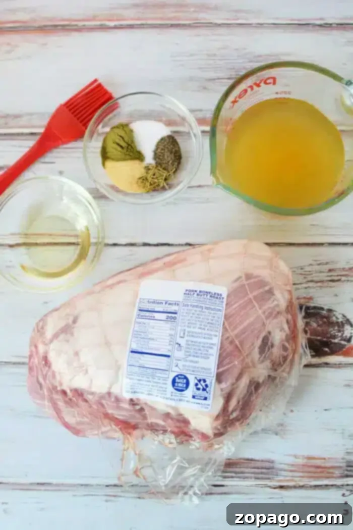 Easy 3-Ingredient Slow Cooker Pork Roast 3 A raw pork shoulder roast in plastic packaging is placed on a wooden surface.