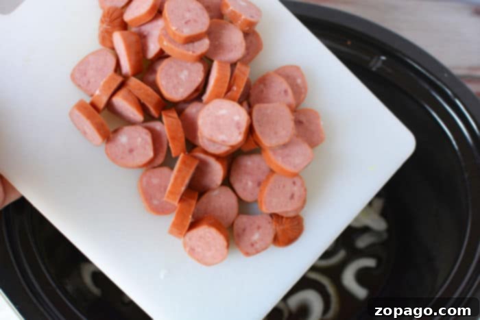 Effortless Slow Cooker Sausage Meals 3 Crockpot sausage recipe with vibrant peppers and sauce