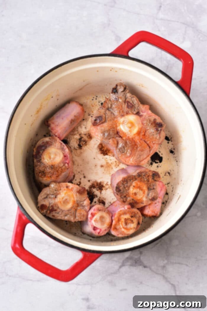 Slow-Cooked Oxtail Perfection 4 Braised Oxtails: A full view of the delicious braised oxtail dish, garnished and ready to be served.