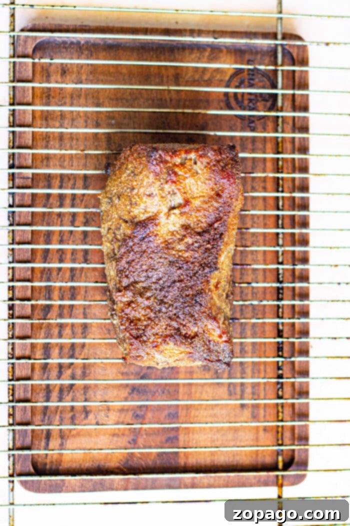 Perfect New York Strip Roast Every Time 5 Baked New York Strip Roast in Oven, sliced to show its medium-rare interior