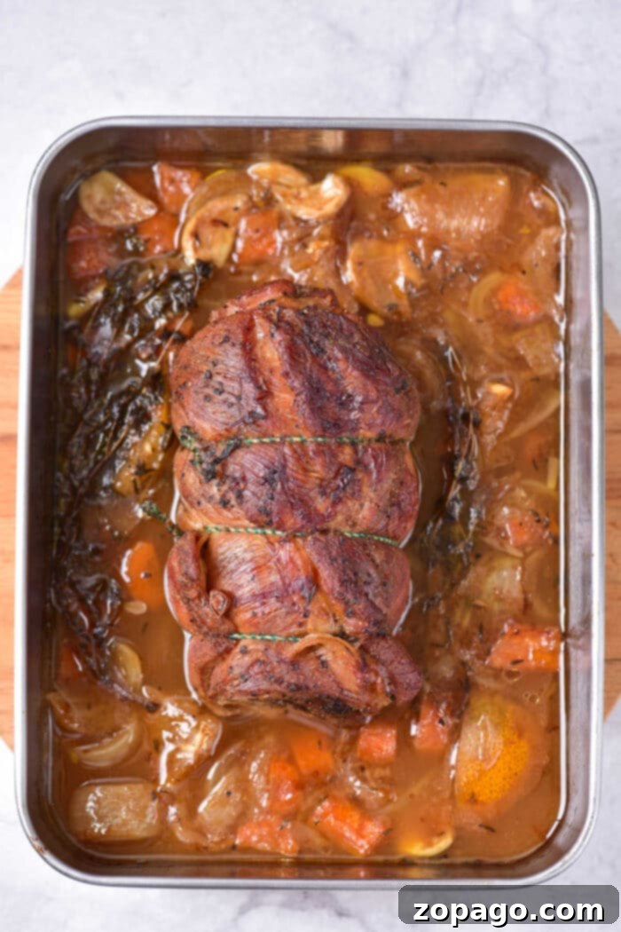 Succulent Lamb Breast 5 Stuffed Lamb Breast, golden brown and perfectly roasted, ready to be sliced and served.
