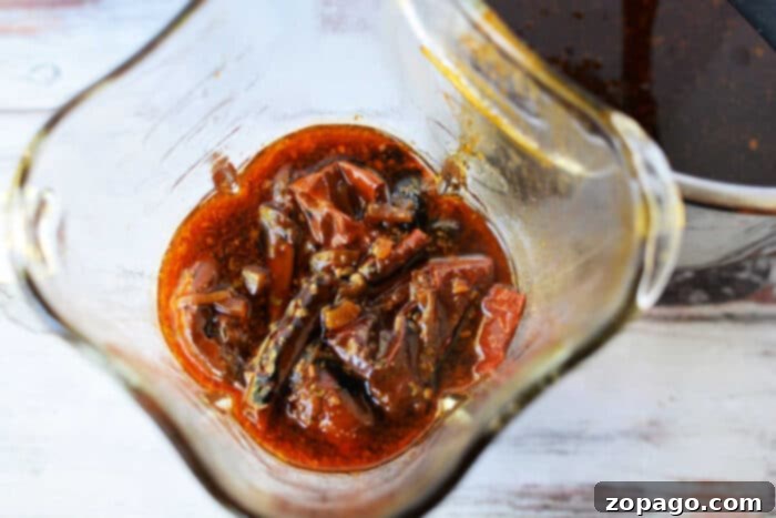 Crafting Perfect Birria Quesadillas 3 Shredded Beef Quesadillas ready to be dipped in flavorful birria consomé.