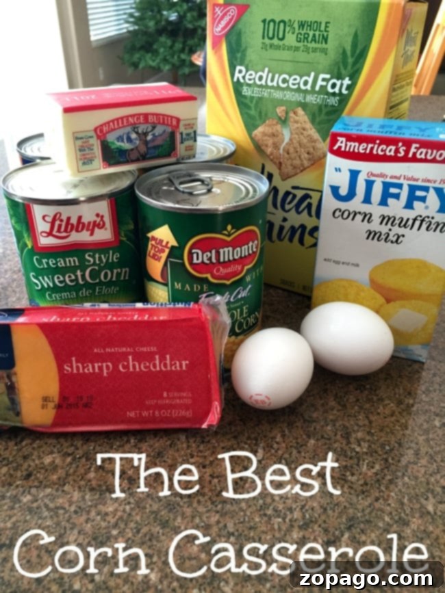 Discover the best cream corn casserole recipe! Made with Ritz crackers, Jiffy cornbread mix, and plenty of cheese, it's a fabulous vegetable side dish for holidays or any time. A close-up of the best corn casserole made with Jiffy corn muffin mix, showing its rich, cheesy topping and moist interior.