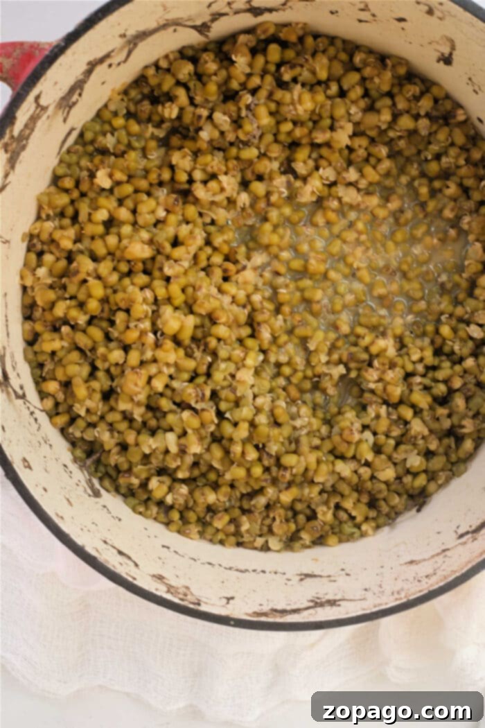 Mastering Mung Bean Cookery 5 Mung beans simmering in a pot on the stove, a classic cooking method
