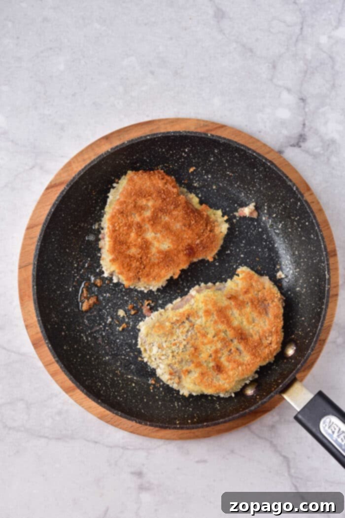 Tenderized Venison Steak 7 Crispy breaded venison steak, perfectly cooked and ready to be served, highlighting the golden-brown crust.