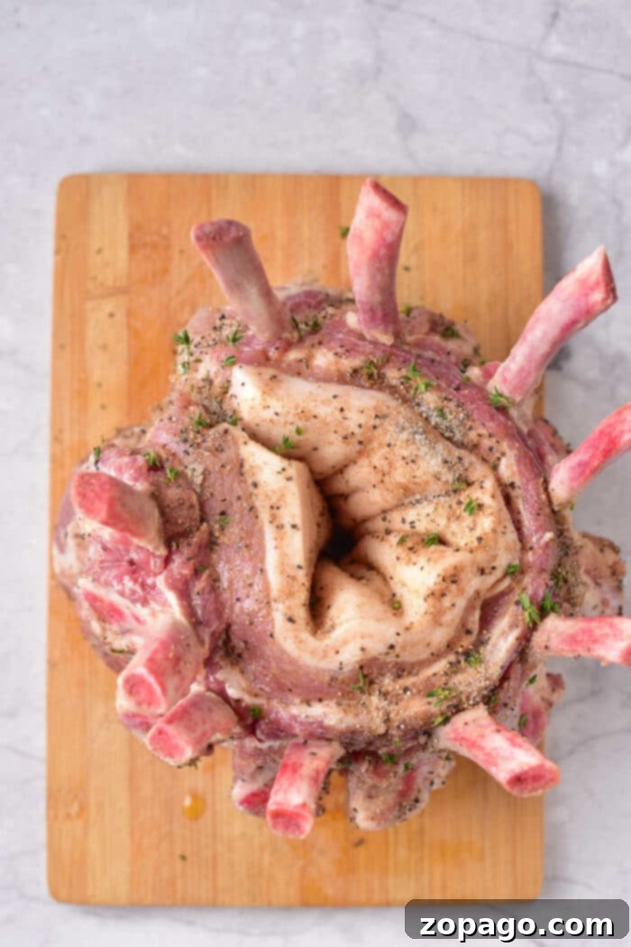 Festive Crown Pork Roast 3 Crown of Pork, beautifully roasted and garnished with herbs.
