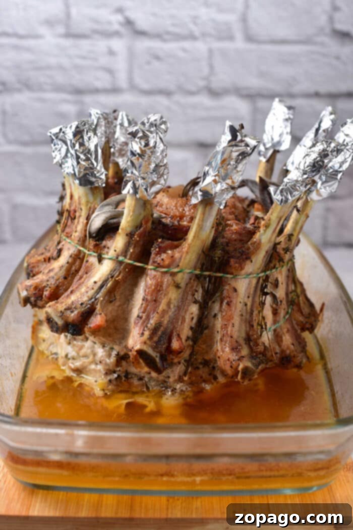 Festive Crown Pork Roast 5 Pork Crown Roast - A magnificent cooked pork crown roast, ready for serving.