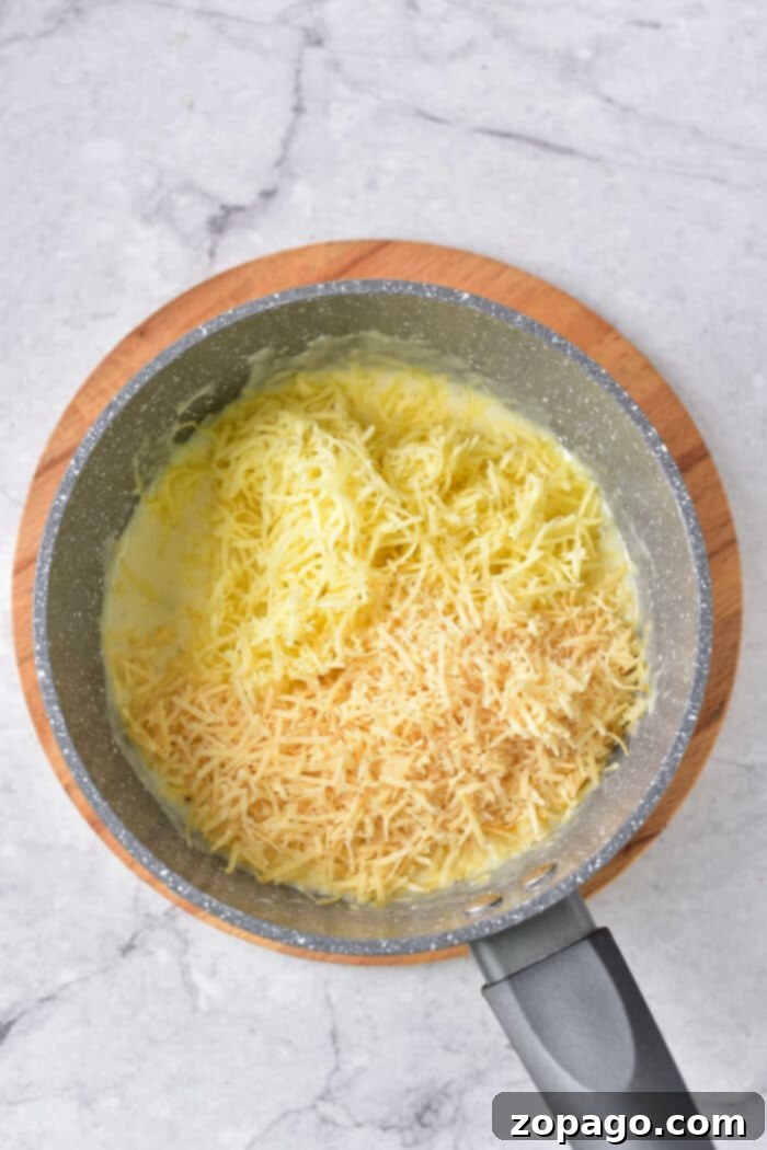 Creamy Dairy-Free Scalloped Potatoes 4 Dairy Free Au Gratin Potatoes - A close up of a serving of dairy-free au gratin potatoes on a plate, showing the creamy layers.