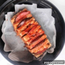 Perfect Halloumi Every Time 7 A loaf of halloumi cheese sliced and cooked in the air fryer, perfect for an easy recipe.