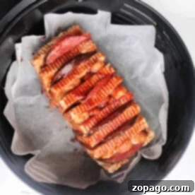 A loaf of halloumi cheese sliced and cooked in the air fryer