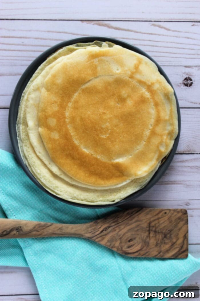 Classic Ham and Cheese Crepes 3 Savory Crepe Recipe: A close-up of a perfectly cooked crepe ready for delicious savory fillings.