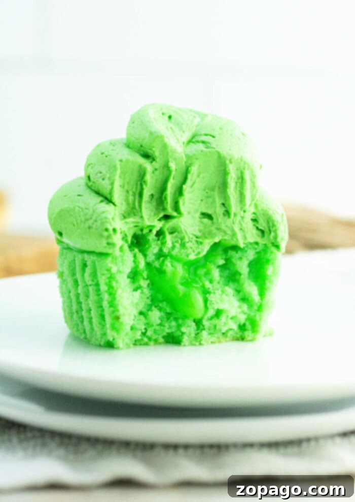 Creamy Curd Cupcakes 2 Vibrant Green Lime Curd Cupcakes with frosting and sprinkles