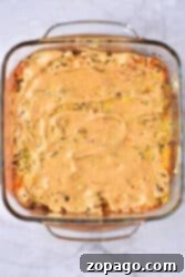 Special Sauce Cheeseburger Casserole 9 A square glass dish with a creamy Big Mac casserole sits enticingly on a marble surface.