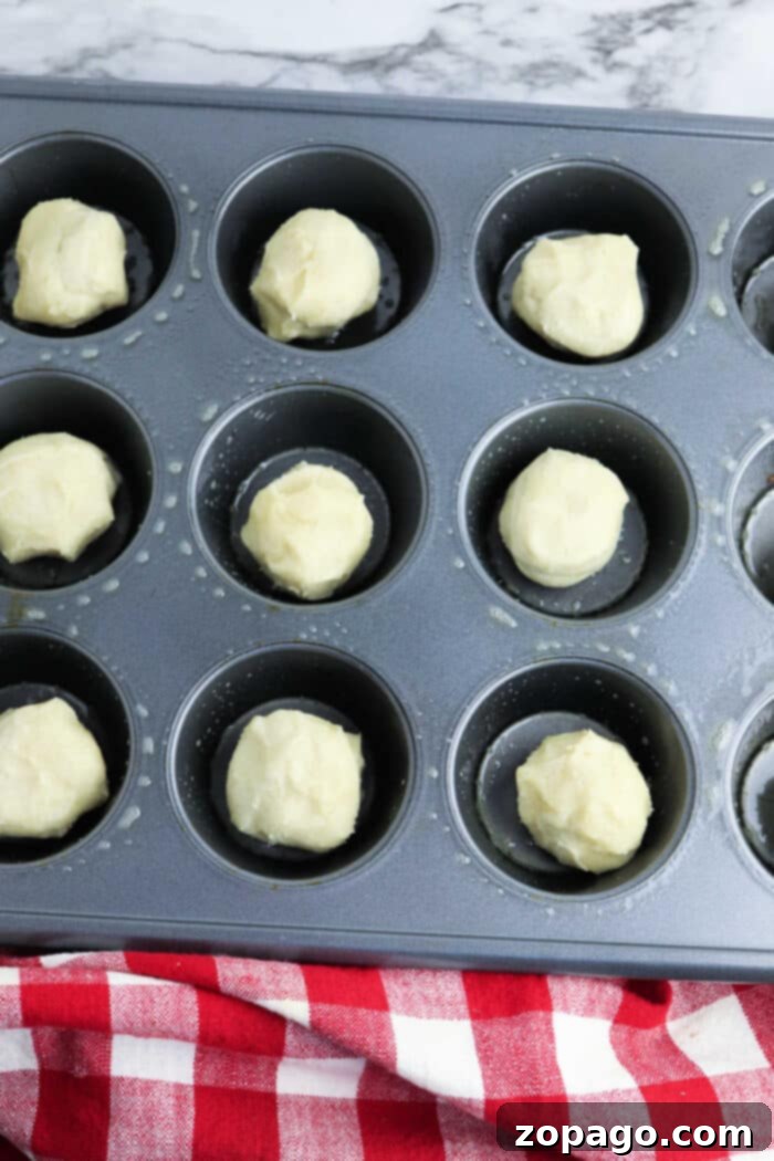 Cookie Cups: Tiny Treats, Big Flavor 4 Three perfectly baked sugar cookie cups, each filled with a different enticing topping: one with a smooth cream, another with fresh berries, and a third with a rich, dark filling, showcasing the endless possibilities for customization.
