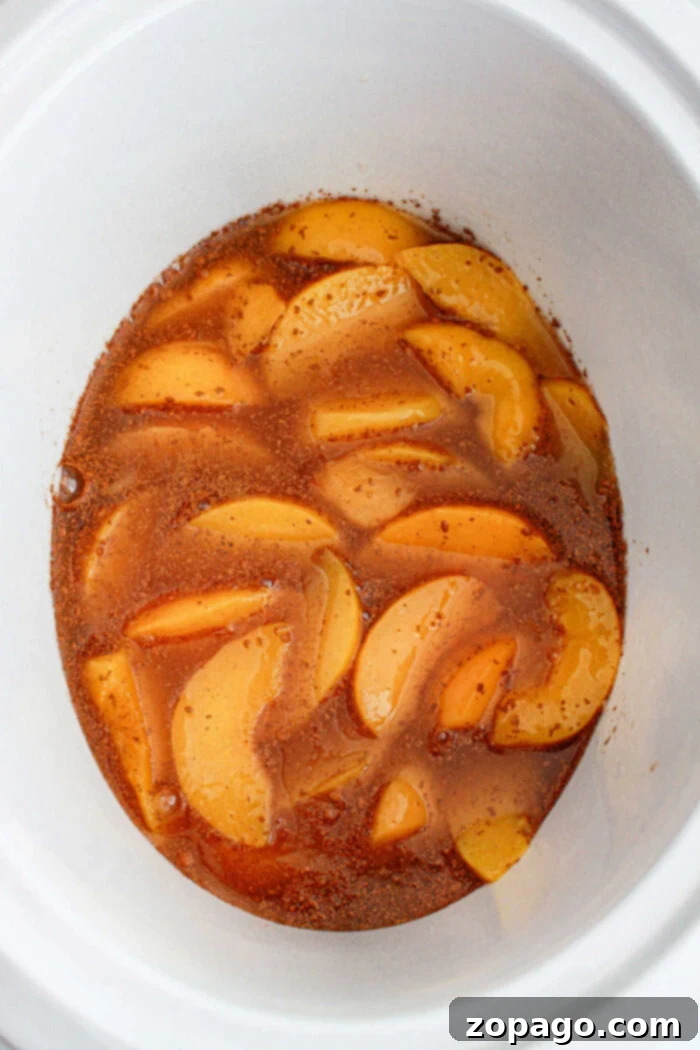 Slow Cooker Peachy Dump Cake 4 peach cobbler in a slow cooker