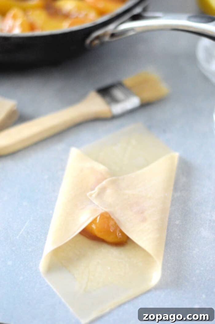 Golden Peach Cobbler Rolls 6 Freshly prepared dessert featuring frozen peaches, suggesting a sweet and convenient treat.