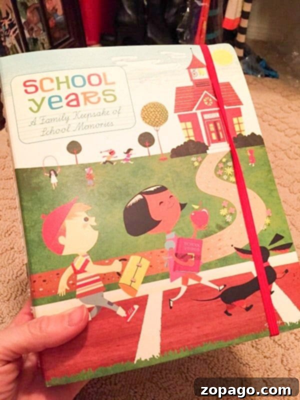 School Days Keepsake 3 Open school memory binder showing pockets for report cards and filled pages
