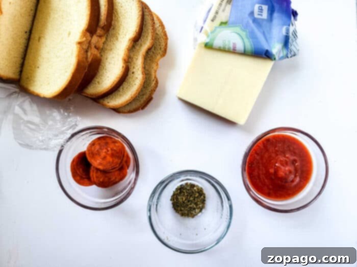 Pizza Toasties 3 Air Fryer Pizza Toast: Two slices of bread with cheese and pepperoni, ready for the air fryer.