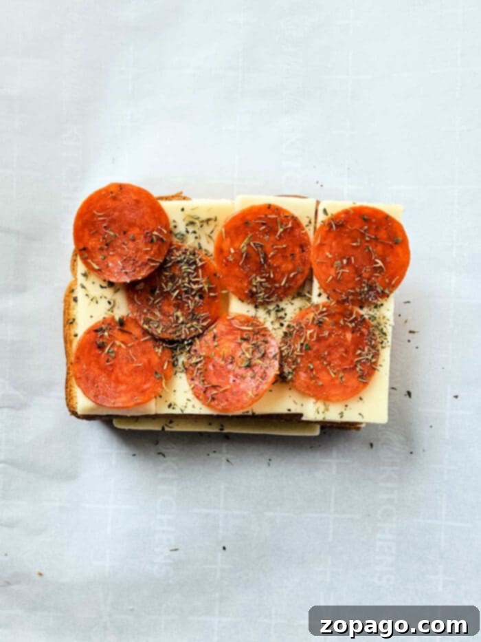 Pizza Toasties 5 Delicious and easy Pizza on Toast with pepperoni and melted cheese.