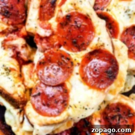 Pizza Toasties 7 Close-up of Grilled Cheese Pizza Toast featuring pepperoni slices with melted cheese and herbs.