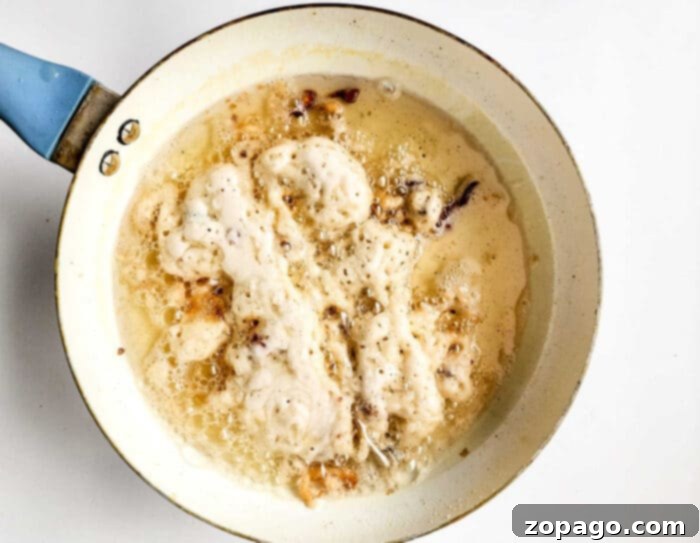 Learning how to make a funnel cake, with the same satisfying sizzle and delicious aroma wafting through the kitchen, promising a delightful treat.