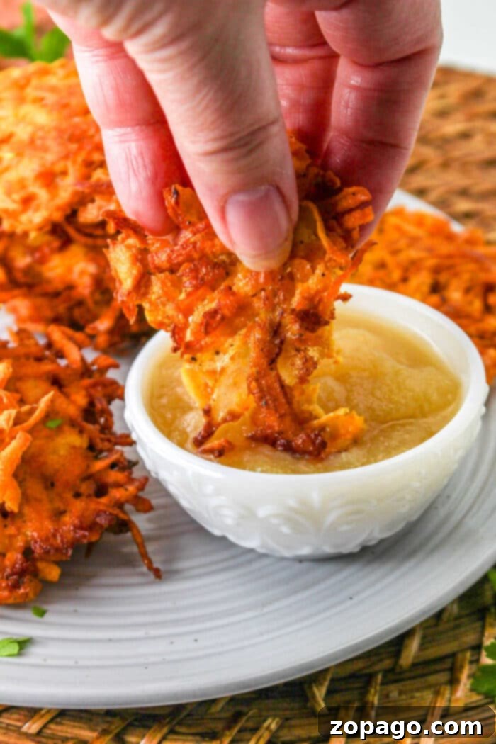 Golden Sweet Potato Latkes 7 A single sweet potato latke, perfectly golden and crispy