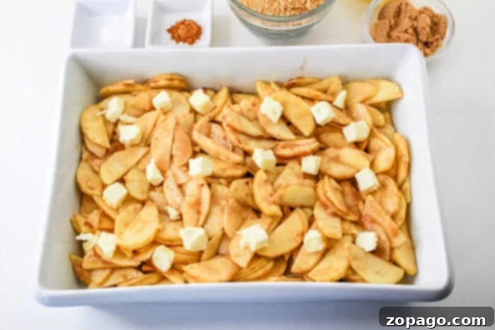 Warm Spiced Apple Bake 6 Cinnamon apples baking in the oven, with a crispy, golden-brown topping