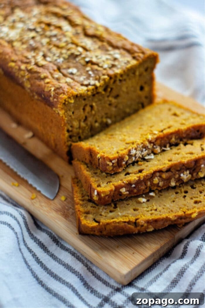 Golden Maple Pumpkin Harvest Loaf 7 Sliced maple pumpkin bread ready to be served, perfect for a cozy autumn gathering.