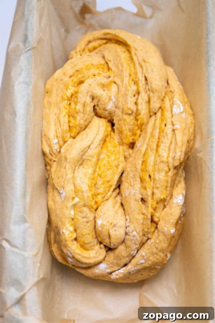 Easy One-Bowl Braided Pumpkin Yeast Loaf 6 Braided Pumpkin Bread, showing the baked loaf on a cooling rack