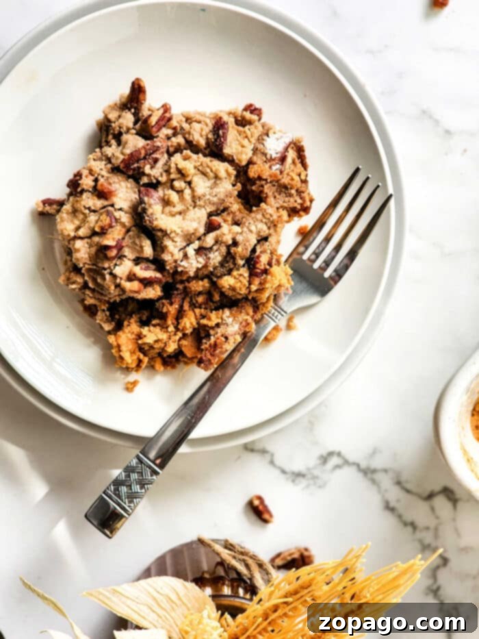 Spiced Sweet Potato Dump Cake 8 Close-up of a rustic Sweet Potato Dump Cake, showcasing its delightful texture and pecan topping.