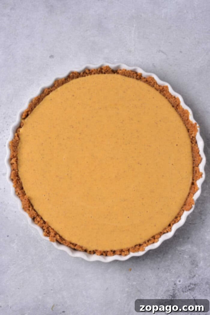 Creamy Pumpkin Custard Pie 5 Close-up of the smooth, rich pumpkin custard filling before baking.