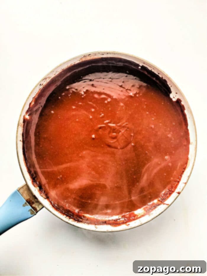Chocolate Drenched Biscuit Dreams 5 Chocolate Gravy recipe presented in a bowl, ready to be served.