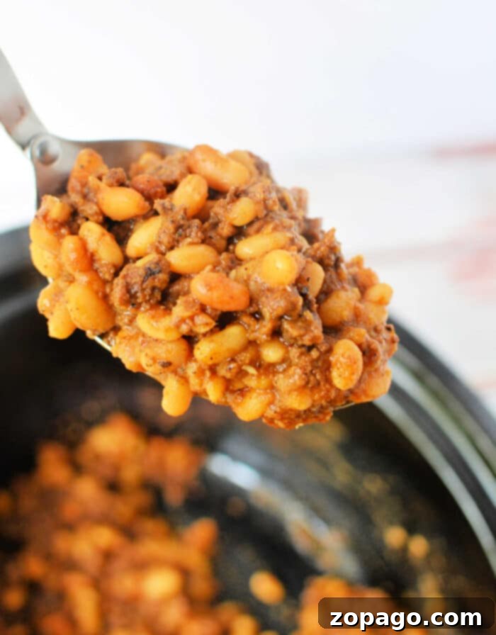 Hearty Beef and Bean Bake 7 Baked Beans with Ground Beef, served in a rustic bowl