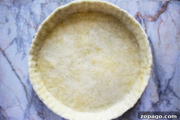 Rustic Russet Potato Galette 4 Homemade pie crust nestled in a tart pan, ready for filling