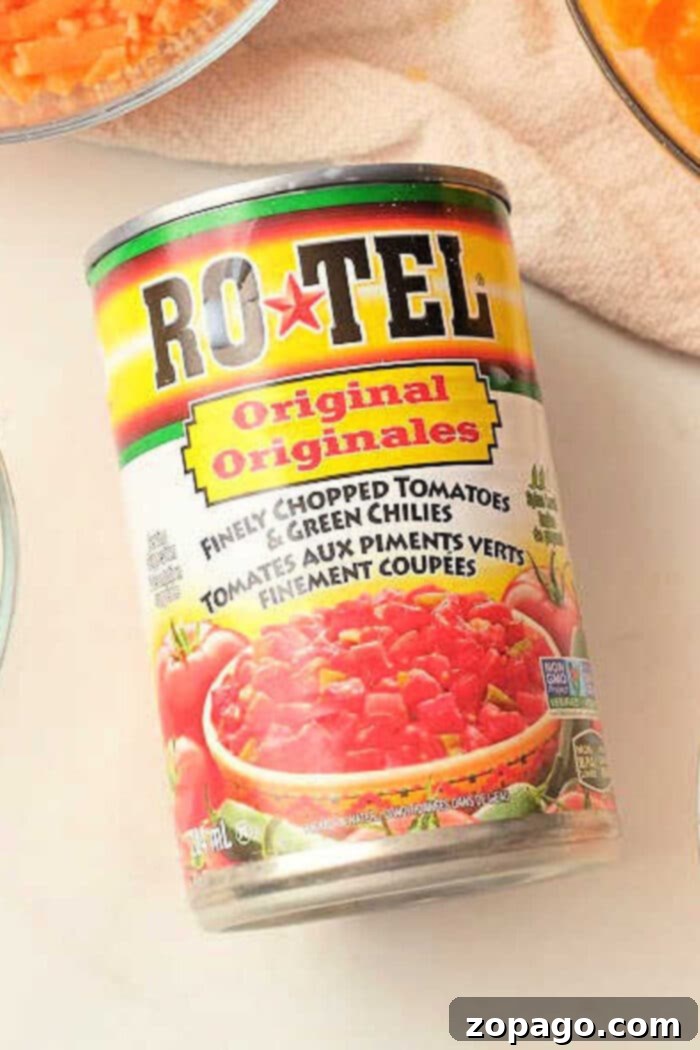 Easy Homemade Rotel 2 Homemade Rotel substitute with diced tomatoes and green chilies in a bowl, ready for use in recipes.