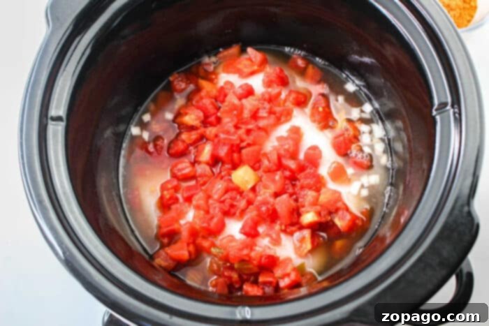 Easy Homemade Rotel 7 A large bowl of homemade Rotel, showcasing its vibrant red and green colors, emphasizing its versatility in cooking.