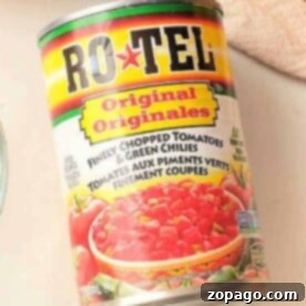 Close-up of a can of Ro-Tel Original with chopped tomatoes and green chilies, perfect for crafting your own homemade Rotel recipes.