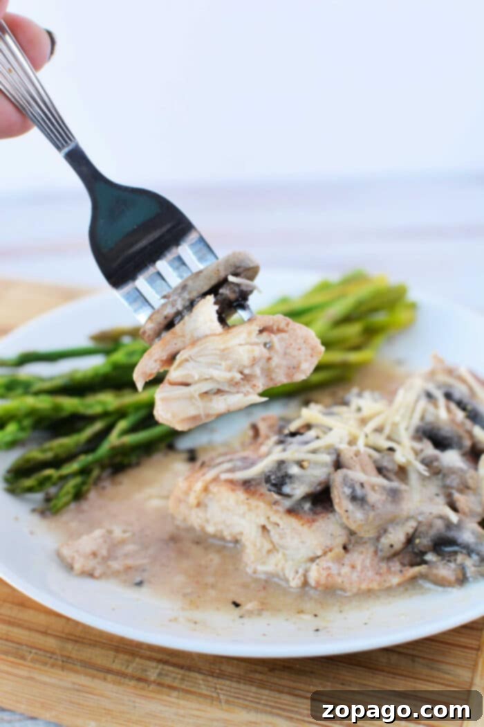 Creamy Mushroom Chicken Delight 7 Frozen Chicken and Cream of Mushroom Soup cooking in a slow cooker.