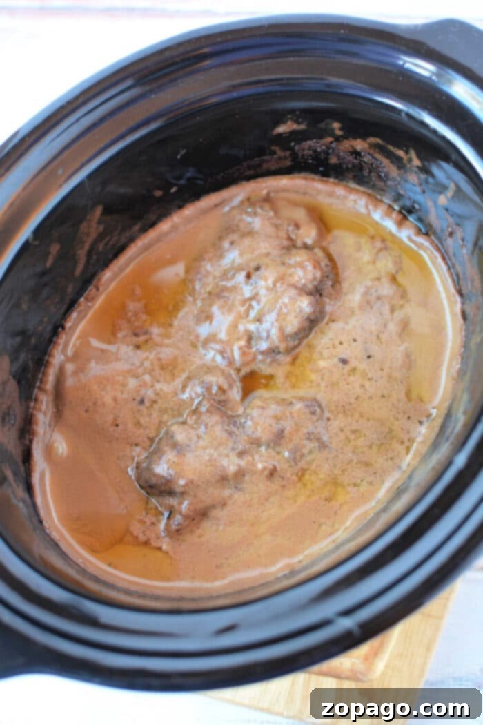 Effortless Crockpot Salisbury Steak 6 Crockpot Salisbury Steak with Cube Steak variation, showing a different texture of beef in the same rich gravy.