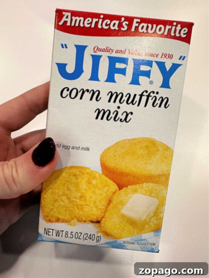 Effortless Cheesy Corn Bake 4 Perfectly baked Jiffy Cream Cheese Corn Casserole, golden and bubbly, ready for serving.