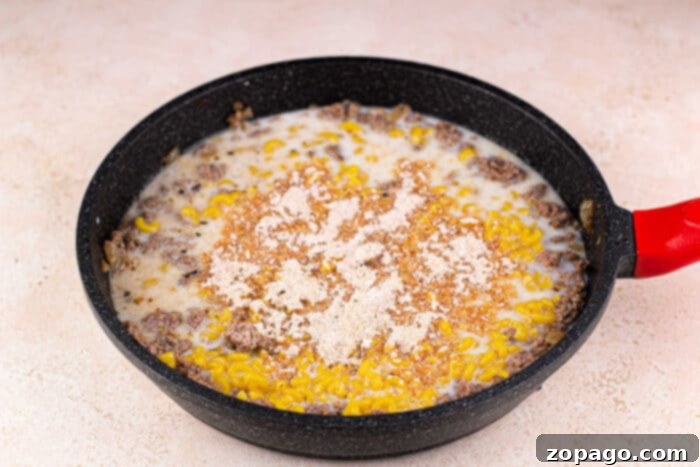 Cheeseburger Mac 5 Skillet hamburger macaroni cooking on the stovetop.