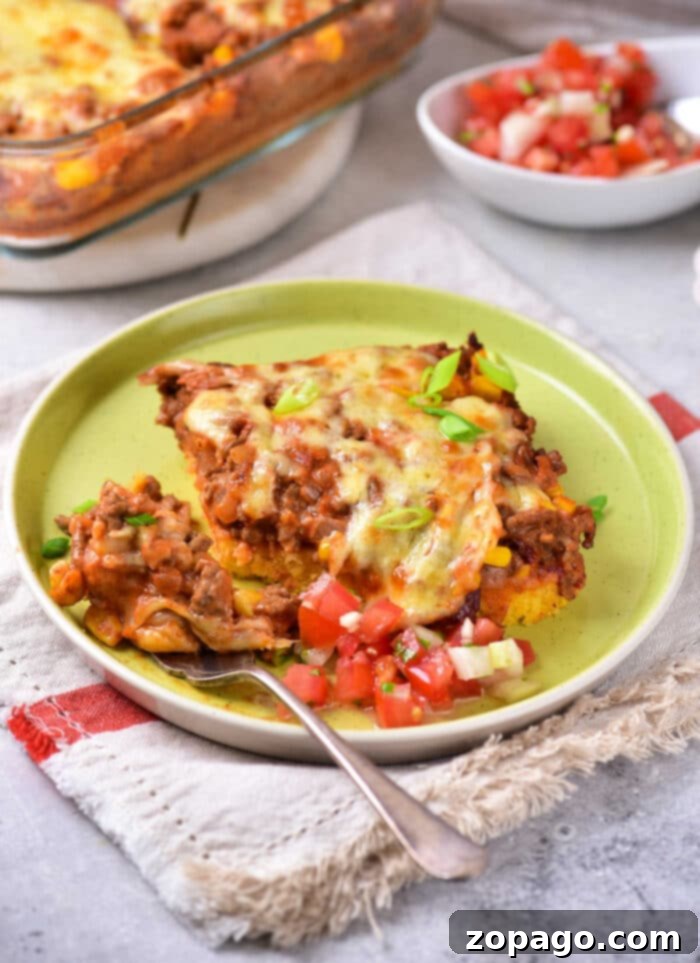 Hearty Taco Cornbread Bake 2 Delicious Taco Cornbread Casserole, a perfect blend of savory beef and golden cornbread.