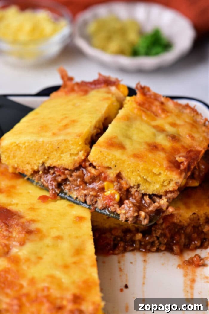 Hearty Ground Beef Casserole with a Golden Cornbread Topping, Ready to Serve